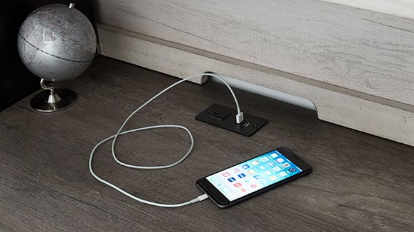 Some desk and vanity tops feature electrical and USB outlets